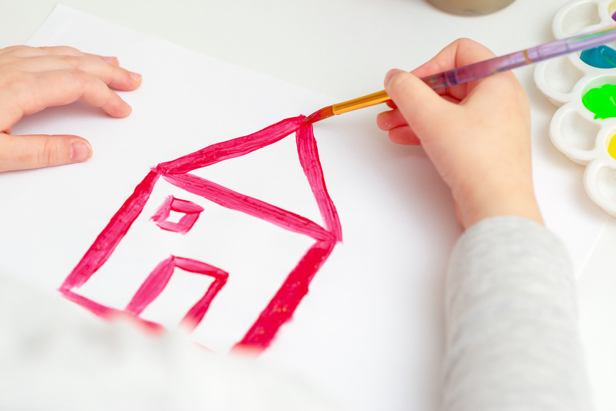 Child's Hand Drawing the House.